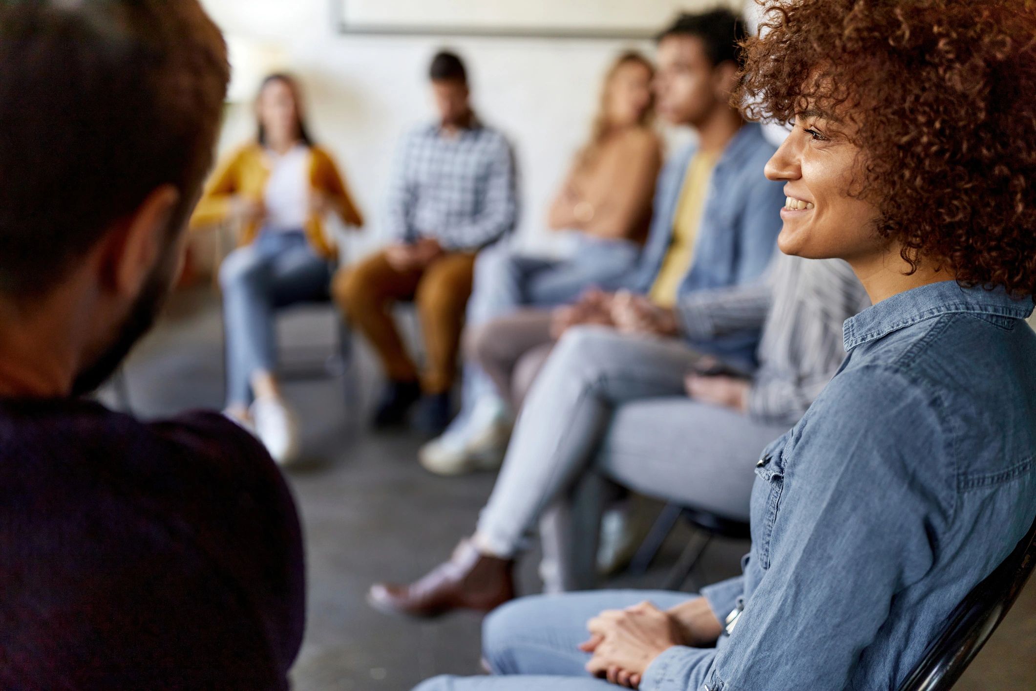 Group support meeting in an office setting