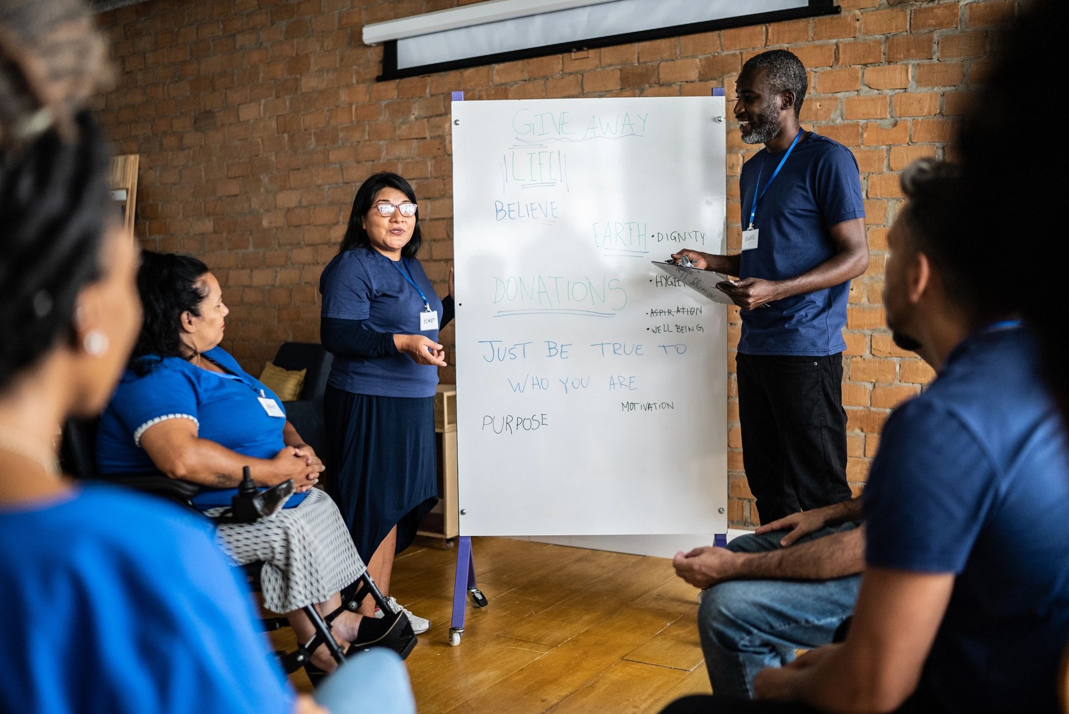 Adults participating in a job training workshop discussion
