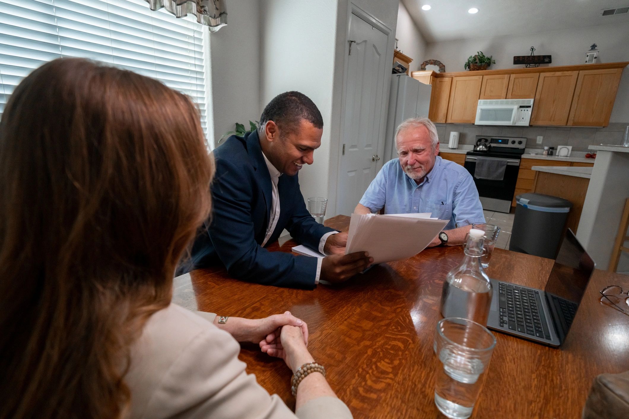 Advisor meeting with a couple to review options and paperwork