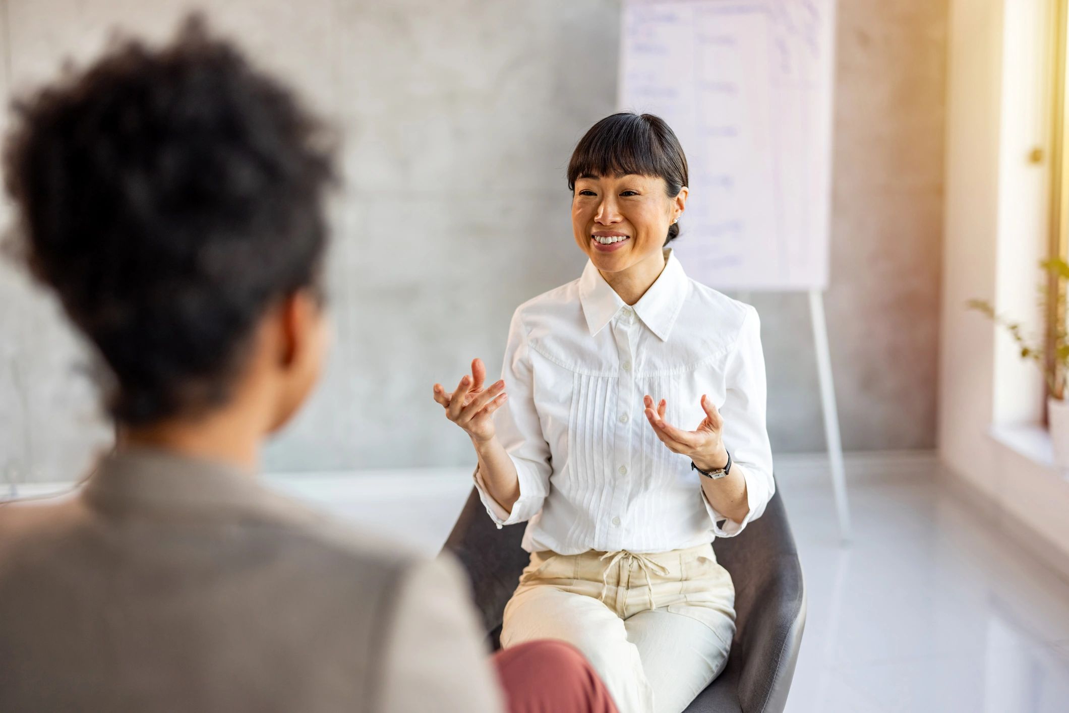 Supportive coaching conversation in a private office