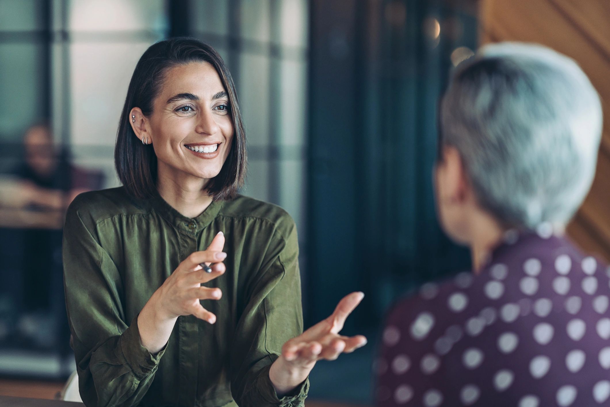 Two professionals meeting to coordinate support services